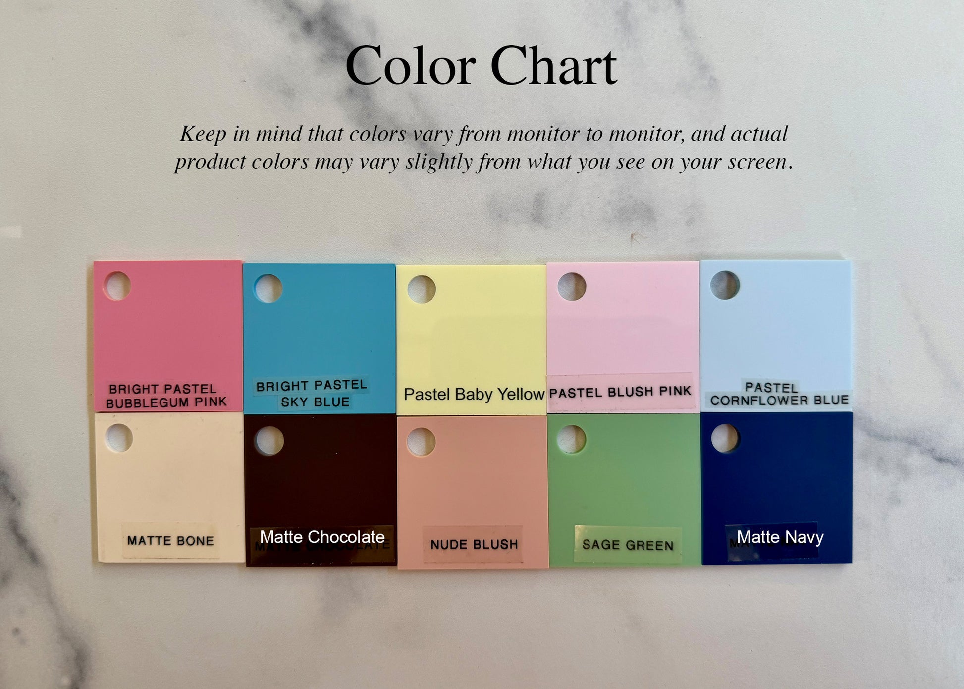 Color chart with pastel and matte color swatches on a marble background