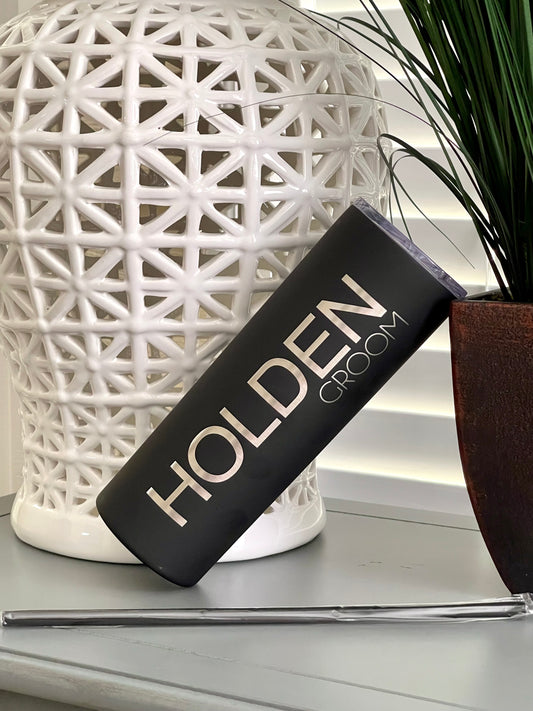 A personalized engraved 20 oz. stainless steel groom tumbler with a clear push-on lid, displayed in front of a white geometric.
